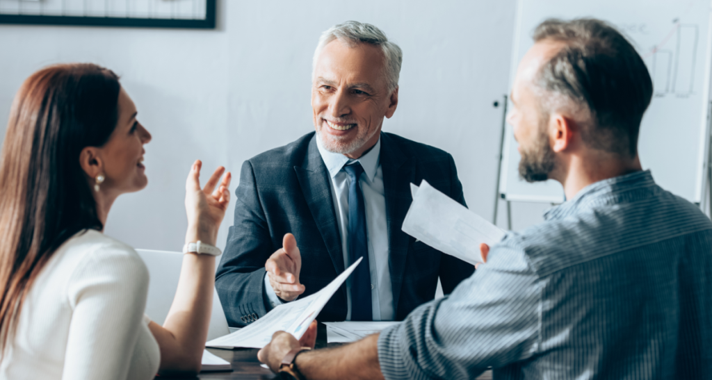 Business professionals engaged in a lively discussion during a meeting.